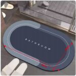 Mata łazienkowa o wymiarach 60x40 cm z napisem BATHROOM na tle nowoczesnej łazienki.