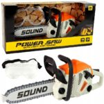 Zabawka piła mechaniczna z dźwiękiem i światłem w pudełku, z dołączonymi okularami ochronnymi dla dzieci od 3 lat.