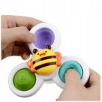 Dziecięcy spinner pszczółka z trzema przyciskami sensorycznymi w kolorach zielonym, fioletowym i niebieskim.