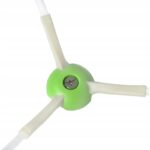 Część zamienna do narzędzia ogrodowego, zielony plastikowy element z trzema ramionami i śrubokręt w centrum.