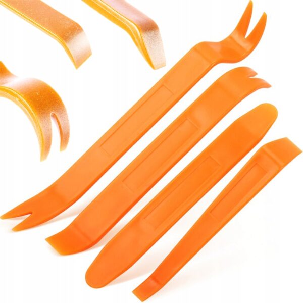 Zestaw pomarańczowych plastikowych narzędzi do demontażu tapicerki samochodowej, ergonomiczny i wielofunkcyjny.